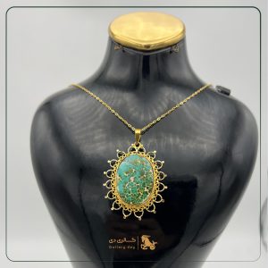 سنگ با قاب طلا مدل خورشیدی.
